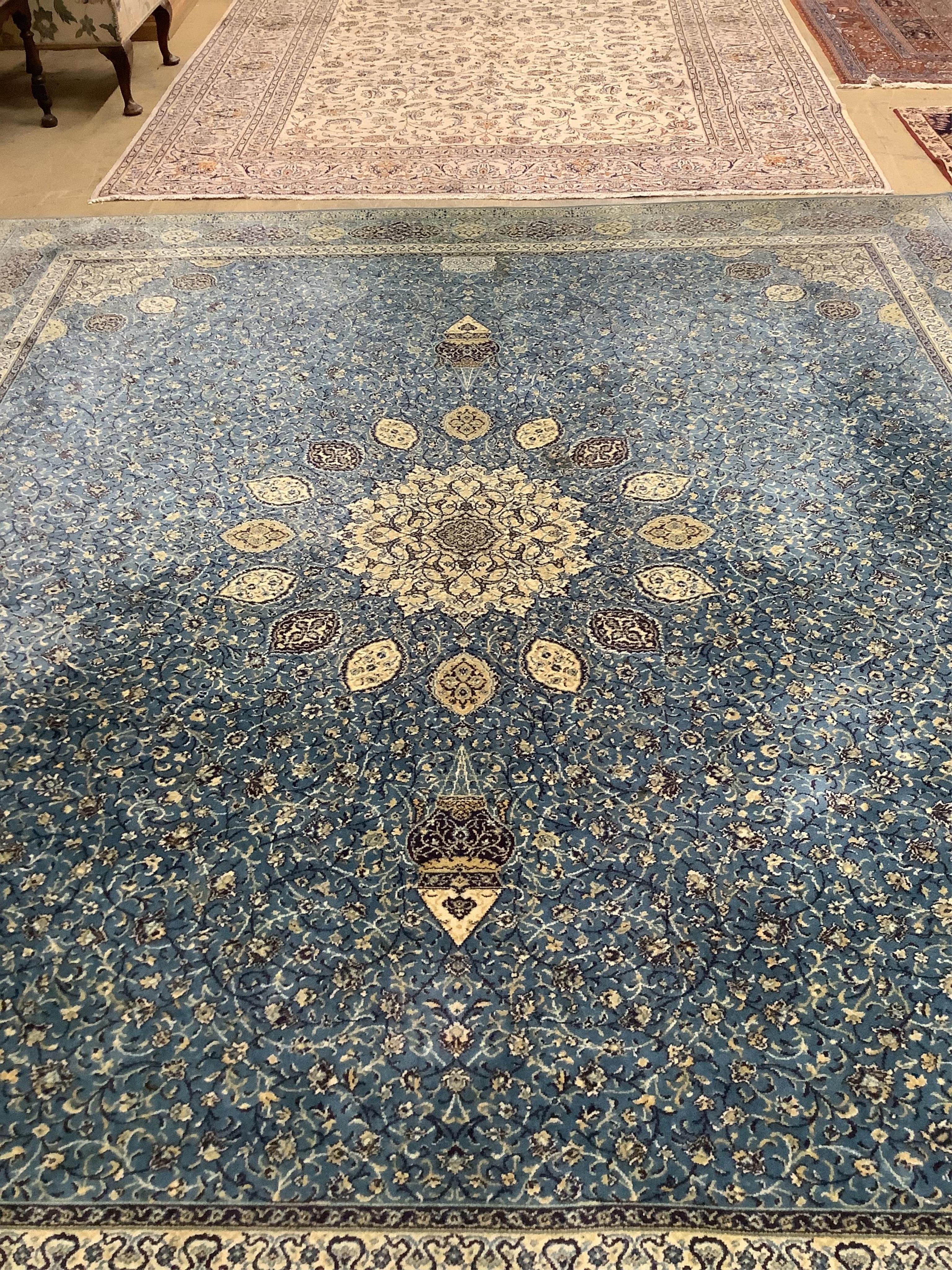 A Wilton Kashmir style machined blue ground carpet, 364 x 320cm. Condition - good